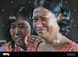 Friends and family of former Khmer Rouge chief Ta Mok weep as they view his  body during services Saturday, July 22, 2006, in Anlong Veng, Cambodia. Ta  Mok, known as the "Butcher"