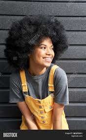 The look can be simple and chic or textured and funky, whatever short hairstyle you may go for it will surely get you noticed. Happy Stylish African Image Photo Free Trial Bigstock