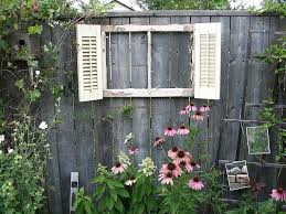 Jazz Up That Fence Maybe Even Put A Mirror Behind Or Paint An Outdoor View Behind It Backyard Fence Decor Outdoor Window Decor Backyard Fences