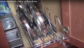Clearly she took the drawers out and she added hooks to the top underside of the dresser so she could hang them. Video Organizing Pots Pans