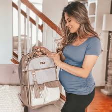 Includes stroller straps and a coordinating changing pad. Itzy Ritzy Boss Diaper Bag Backpack Vanilla Latte