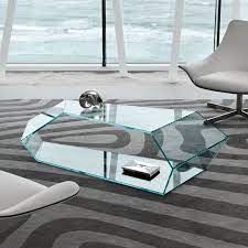 It features storage space in the bottom two levels, while the top two levels rotate 360 degrees for multiple looks. Need To Find Specs Furniture Design Modern Glass Furniture Modern Glass Coffee Table