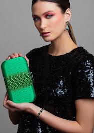 Nia Sioux Rocks Ariel Taub's Kelly Green Ella Clutch at the Wicked Premiere