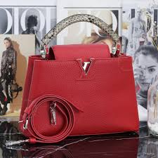 LOUIS VUITTON CAPUCINES BB LIMITED EDITION TAURILLON LEATHER WITH PYTHON  HANDLE
