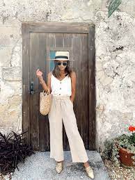 How To Wear A Straw Hat 14 Ways Finding The Right Fit And Style For You The Effortless Chic Italy Outfits Europe Outfits Linen Pants Outfit