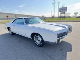 Image result for Riviera Champagne 1966 Buick