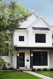 The latest lifestyle | daily life news, tips, opinion and advice from the sydney morning herald covering life and relationships, beauty, fashion, health & wellbeing White Batten And Board Exterior With Black Porch Columns Black Windows And Black Metal Modern Farmhouse Exterior House Designs Exterior White Exterior Houses