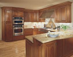 The light wood of these floors and cabinets balances the bold. Starmark Cabinetry Kitchen In Cherry Finished In Toffee Traditional Kitchen Other By Starmark Cabinetry Houzz