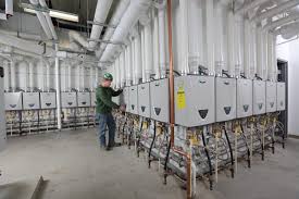 Tankless hot water heater outside. Big Lineup 29 A O Smith Tankless Units Keep Hotel Guests In Hot Water A O Smith Newsroom