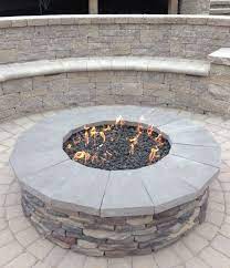 Gas Firepit With Stone Veneer And Natural Stone Caps Seating Wall Behind Gas Fire Pits Outdoor Natural Gas Fire Pit Fire Pit Patio
