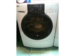 This is the manual release for the door. Repairing Kenmore Elite He3 Washer Control Board Relays Ifixit Repair Guide