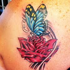 It features two single rose blooms surrounded by expertly drawn leaves. Rose And Butterfly Tattoo Butterfly Back Tattoo Butterfly Tattoo Designs