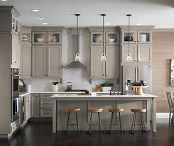 Dark shades of gray and wine. Ahh The Comfort Of A Warm Stone Gray Kitchen The Neutral Color Palette Of The Laminat Timeless Kitchen Cabinets Kitchen Cabinet Door Styles Timeless Kitchen