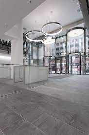 for its new headquarters the sparkasse bank in hannover has chosen the stoneline collection the stone effect surfa design interior decorating design projects