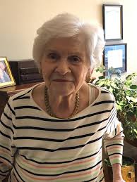 Can someone remove the strap from the shoe in this photo?