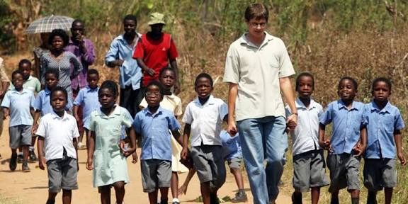 Volunteers working with children in Africa