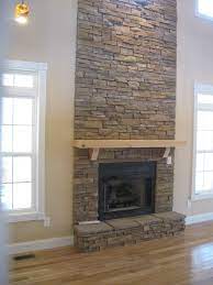 Fireplaces and chimneys have long been created using natural stone. Where To Buy Stacked Stone Tile Stacked Stone Fireplaces Stone Veneer Fireplace Stone Fireplace Surround