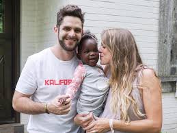 She's not phased though cause it's kinda sepia and sepia is a kind photo setting. Thomas Rhett And Wife Welcome Adopted Child Home Kixb Cm