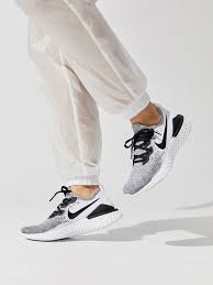 Nike Women S Epic React Flyknit 2 White Black Pure Platinum Performance Sneakers In 2020 Nike Cortez Black Womens Athletic Shoes Flyknit Women