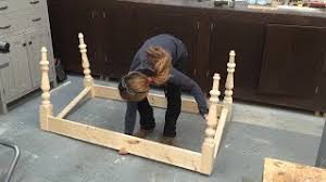 A rectangular top is made of solid reclaimed wood in natural worn brown shades. How To Build A Farmhouse Table Part 1 Table Base With Turned Legs Youtube