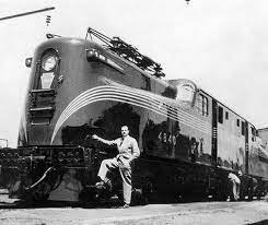 raymond loewy stands next to his masterpiece the gg1 electric locomotive raymond loewy train