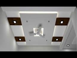 In the centre of the ceiling, a recession is created to hold the two small fans, which almost seem to blend. Latest Gypsum Ceiling Designs 2018 False Ceiling Decorations For Living And Bedroom Pop False Ceiling Design Simple False Ceiling Design False Ceiling Design