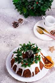 Select from premium christmas bundt cake of the highest quality. Christmas Homebaked Dark Chocolate Bundt Cake Decorated With White Icing And Holly Berry Branches On A Light Concrete Background Stock Photo Picture And Royalty Free Image Image 132866110