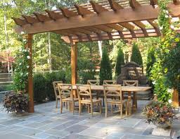Flagstone patio ideas have a porch that stretches around one or more sides. Flagstone Patio Benefits Cost Ideas Landscaping Network