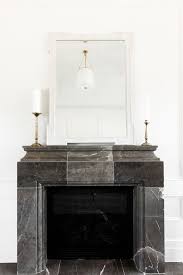 Black And White Fireplace Surround Black Marble Fireplace Mirror Above Fireplace White Lighting Candle Sticks Marble Mantle Marble Fireplaces Marble Fireplace Surround Fireplace Mirror