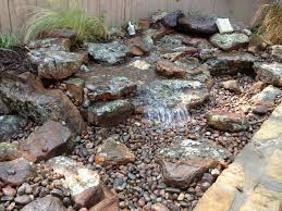Preformed pieces for a reservoir can be found at a home improvement store or nursery. Disappearing Backyard Pondless Waterfall Tx Decatur North Texas Tx Arlington Fort Worth Dfw Ponds Inc