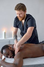 Young Black Guy Having Healing Full Body Massage from Male Therapist at Luxury Spa. Stock Image - Image of healthy, male: 266236511