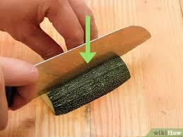 Trim ends off zucchini and grate them either on the large holes of a box grater or, if you have one, using the shredding blade of a food processor. 4 Ways To Cut Zucchini Wikihow