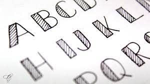 Next, draw the outline for your graffiti letters, letting the larger outlines touch or overlap. How To Write Fancy Letters Fancy Letters Calligraphy Fancy Letters Youtube
