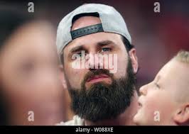 Former Los Angeles Dodgers Scott Van Slyke watches his former team take