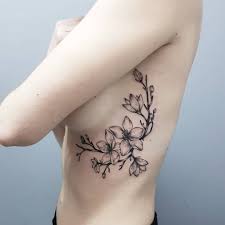 Simple cherry blossom back tattoo ink idea for the ladies. 26 Sophisticated Cherry Blossom Tattoo Designs