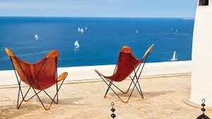 Use it in the living room around the coffee table, in the bedroom, in your reading nook, even at the dining room table. The Story Behind The Iconic Butterfly Chair Design Architectural Digest