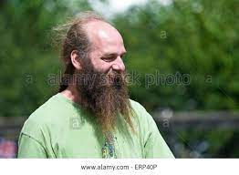 Stock Photo A Man With A Bald Head But A Very Long Beard And A Pony Tail Looks Very Content In The English Countryside Long Beards Bald Heads Going Bald