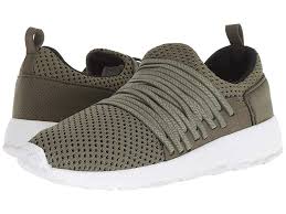 Hey Dude Essie Olive White Women S Shoes Comfort Meets An Innovative Design With The Hey Dude Essie Sneaker Bi Co With Images White Shoes Women Hey Dude Signature Logo