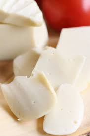 Closeup Side View Of Slices Of Vegan Mozzarella Cheese With Cheese Blocks In The Background Vegan Cheese Recipes Vegan Recipes Vegetarian Vegan Recipes