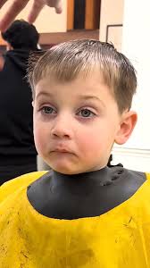Toddler struggles to stay awake while getting haircut 😂💈