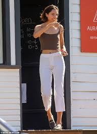 Vanessa Valladares visits a wellness store in Byron Bay before driving off  in a very old car