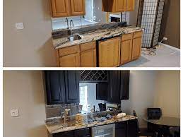 With golden details and black accents, the cabinet is as decorative as it is functional. Tips For Painting Kitchen Cabinets Black Dengarden