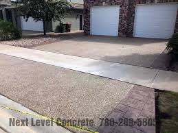 Once you stage the box, hammer stakes into the perimeter to hold it securely in place. Edmonton Exposed Aggregate Next Level Concrete Ltd