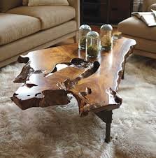 Large coffee tables feature two faux drawer accents opposite their real drawers. Root Slab Coffee Table Arhaus Curio Design Studio