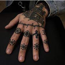 Black Snowflake Tattoos On Left Hand S Fingers Finger Tattoos Hand Tattoos For Guys Knuckle Tattoos
