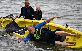 Lib Dem 2023 conference: Ed Davey tipped in to the sea while kayaking in  Bournemouth