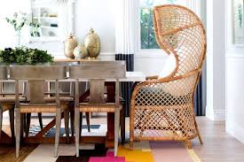 An Eclectic Styled Dining Room With Natural Rattan Chairs At The Head Of The Table Decor Living Room White Home