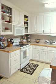 To clean white laminate cabinets, create a mixture of 1 tablespoon baking soda and 1 gallon of warm water. How To Re Paint Your Yucky White Cabinets The Frugal Homemaker