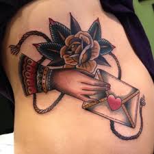 I am a tattoo artist who has been working to be the best i can be for some years now. New School Style Colored Side Tattoo Of Woman Hand With Envelope And Rose Tattooimages Biz