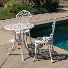 For smaller spaces such as porches or patios, a round patio side table or compact outdoor furniture can create a warm and inviting ambiance. White Cast 3 Piece Bistro Outdoor Patio Set Leaf Design Weather Resistant Round Table 2 Chairs Garden Furniture China Cast Iron Furniture Patio Furniture Made In China Com